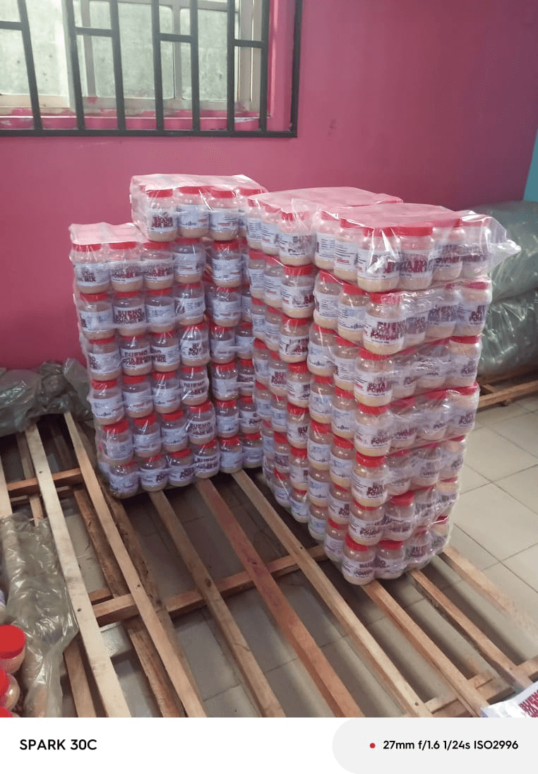 Pallets of shrink-wrapped Bueno Soyabeans Powder Mix jars ready for dispatch