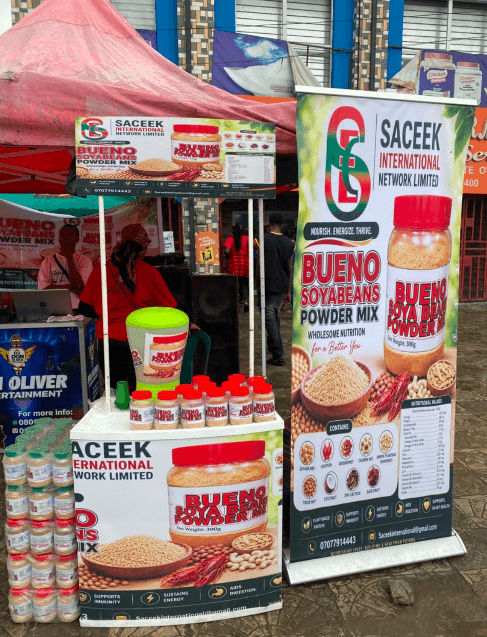 Saceek roll-up banner beside a Bueno product display stand